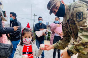 Soldiers and Santa Hold Annual Christmas Toy Distribution for Immigrant Families 
